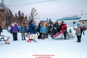 A small crowd gathers around Aliy Zirkle as she checks in to the Koyuk checkpoint during the 2017 Iditarod on Monday evening at sunset  March 12, 2017.Photo by Jeff Schultz/SchultzPhoto.com  (C) 2017  ALL RIGHTS RESERVED