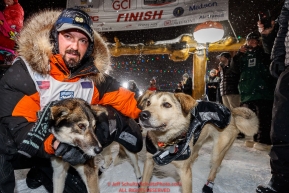 Pete Kaiser congratulates his lead dogs at the Nome finish line shortly after winning the 2019 Iditarod Trail Sled Dog Race. Pete's winning time is 9 days 12 hours 39 minutes and 6 secondsPhoto by Jeff Schultz/  (C) 2019  ALL RIGHTS RESERVED