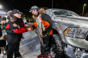 Pete Kaiser accepts his winner's truck from Chuck Talskey of Anchorage Chrysler Dodge at the Nome finish line after winning the 2019 Iditarod Trail Sled Dog Race. Pete's winning time is 9 days 12 hours 39 minutes and 6 secondsPhoto by Jeff Schultz/  (C) 2019  ALL RIGHTS RESERVED