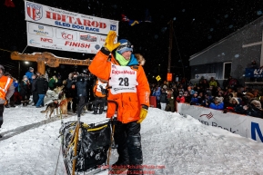 Second place finisher Joar Leifseth Ulsom waves to the crowd shortly after finishing the 2019 Iditarod Trail Sled Dog Race. Photo by Jeff Schultz/  (C) 2019  ALL RIGHTS RESERVED