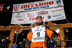 Pete Kaiser stands at his sled at the Nome finish line shortly after winning the 2019 Iditarod Trail Sled Dog Race. Pete's winning time is 9 days 12 hours 39 minutes and 6 secondsPhoto by Jeff Schultz/  (C) 2019  ALL RIGHTS RESERVED