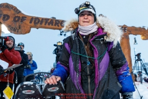 Jessie Royer poses at the Nome finish line shortly after placing 3rd in the 2019 Iditarod sled dog race.Photo by Jeff Schultz/  (C) 2019  ALL RIGHTS RESERVED