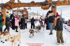 Aliy Zirkle crosses under the burl arch finish line in Nome to a 4th place finish of the 2019 Iditarod on Wednesday March 13Photo by Jeff Schultz/  (C) 2019  ALL RIGHTS RESERVED