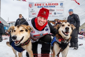Aliy Zirkle poses with her lead dogs at the Nome finish line with her lead dogs Mismo and Dutch after placing 4th in the 2019 Iditarod on Wednesday March 13Photo by Jeff Schultz/  (C) 2019  ALL RIGHTS RESERVED