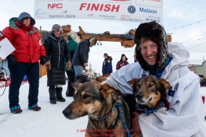 Travis Beals poses with his leaders in the finish chute in Nome after taking 5th place during the 2019 Iditarod on Wednesday March 13Photo by Jeff Schultz/  (C) 2019  ALL RIGHTS RESERVED