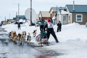 Aliy Zirkle runs down Front Street in Nome on her way to a 4th place finish during the 2019 Iditarod on Wednesday March 13Photo by Jeff Schultz/  (C) 2019  ALL RIGHTS RESERVED