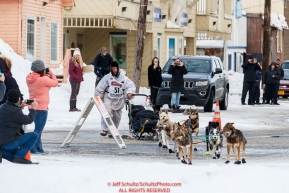 Travis Beals runs into the finish chute in Nome for 5th place during the 2019 Iditarod on Wednesday March 13Photo by Jeff Schultz/  (C) 2019  ALL RIGHTS RESERVED