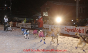 Wednesday March 14, 2012   Aaron Burmeister arrives at the finish line in Nome in 4th place. Iditarod 2012.