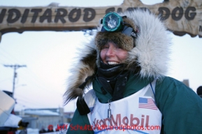 Paige Drobny poses at the finish line after finishing in 34th place on Thursday March 14, 2013. Iditarod Sled Dog Race 2013Photo by Jeff Schultz copyright 2013 DO NOT REPRODUCE WITHOUT PERMISSION