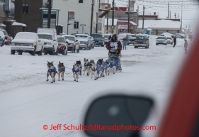 Bob Bundtzen runs up front street in Nome on Friday March 14 during the 2014 Iditarod Sled Dog Race.PHOTO (c) BY JEFF SCHULTZ/IditarodPhotos.com -- REPRODUCTION PROHIBITED WITHOUT PERMISSION