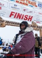 Bob Bundtzen poses at the finish line in Nome on Friday March 14 during the 2014 Iditarod Sled Dog Race.PHOTO (c) BY JEFF SCHULTZ/IditarodPhotos.com -- REPRODUCTION PROHIBITED WITHOUT PERMISSION