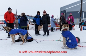 Race fans watch Bob Bundtzen 's dogs in Nome on Friday March 14 during the 2014 Iditarod Sled Dog Race.PHOTO (c) BY JEFF SCHULTZ/IditarodPhotos.com -- REPRODUCTION PROHIBITED WITHOUT PERMISSION