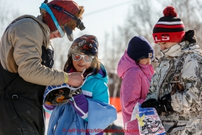 Ben Harper signs autographs for young Huslia residents in the afternoon at the Huslia checkpoint on Saturday  March 14, 2015 during Iditarod 2015.  (C) Jeff Schultz/SchultzPhoto.com - ALL RIGHTS RESERVED DUPLICATION  PROHIBITED  WITHOUT  PERMISSION