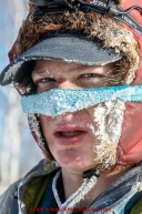 Ben Harper wears a nose mask in the sub-zero temps in the afternoon at the Huslia checkpoint on Saturday  March 14, 2015 during Iditarod 2015.  (C) Jeff Schultz/SchultzPhoto.com - ALL RIGHTS RESERVED DUPLICATION  PROHIBITED  WITHOUT  PERMISSION