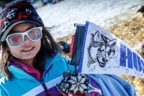 A young Huslia race fan shows her spirit in the afternoon at the Huslia checkpoint on Saturday  March 14, 2015 during Iditarod 2015.  (C) Jeff Schultz/SchultzPhoto.com - ALL RIGHTS RESERVED DUPLICATION  PROHIBITED  WITHOUT  PERMISSION