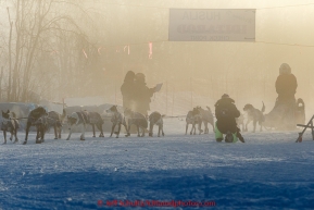 Charley Benja arrives and checks into the Huslia checkpoint in the fog on Saturday  March 14, 2015 during Iditarod 2015.  (C) Jeff Schultz/SchultzPhoto.com - ALL RIGHTS RESERVED DUPLICATION  PROHIBITED  WITHOUT  PERMISSION