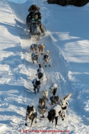 Ray Redington Jr. runs down the steep bank to the Koyukuk river after leaving the Huslia checkpoint on Saturday  March 14, 2015 during Iditarod 2015.  (C) Jeff Schultz/SchultzPhoto.com - ALL RIGHTS RESERVED DUPLICATION  PROHIBITED  WITHOUT  PERMISSION