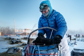 Paige Drobny packs her sled in the morning at the Huslia checkpoint on Saturday  March 14, 2015 during Iditarod 2015.  (C) Jeff Schultz/SchultzPhoto.com - ALL RIGHTS RESERVED DUPLICATION  PROHIBITED  WITHOUT  PERMISSION