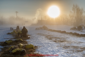 Mats Petterson boots his dogs in the ice fog at 40 below zero in the morning at the Huslia checkpoint on Saturday  March 14, 2015 during Iditarod 2015.  (C) Jeff Schultz/SchultzPhoto.com - ALL RIGHTS RESERVED DUPLICATION  PROHIBITED  WITHOUT  PERMISSION