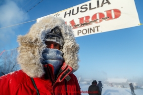 Charlie Benja arrives and checks in at 40 below zero in the morning at the Huslia checkpoint on Saturday  March 14, 2015 during Iditarod 2015.  (C) Jeff Schultz/SchultzPhoto.com - ALL RIGHTS RESERVED DUPLICATION  PROHIBITED  WITHOUT  PERMISSION