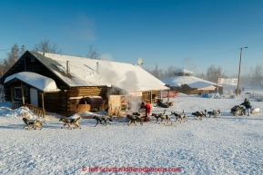 Paige Drobny leaves the dog parking area on the baseball field in the morning at the Huslia checkpoint on Saturday  March 14, 2015 during Iditarod 2015.  (C) Jeff Schultz/SchultzPhoto.com - ALL RIGHTS RESERVED DUPLICATION  PROHIBITED  WITHOUT  PERMISSION