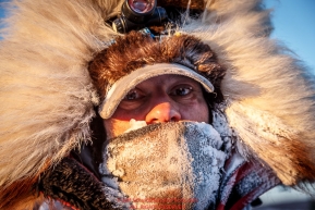 Hugh Neff is bundled up as he arrives at the Koyuk checkpoint on Monday March 14th during the 2016 Iditarod.  Alaska    Photo by Jeff Schultz (C) 2016  ALL RIGHTS RESERVED