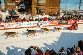Mitch Seavey runs down the chute and crosses the finish line to win his third Iditarod in record time of 8 days, 3 hours, 40 minutes and 13 seconds in Nome during the 2017 Iditarod on Tuesday afternoon March 14, 2017.Photo by Jeff Schultz/SchultzPhoto.com  (C) 2017  ALL RIGHTS RESERVED