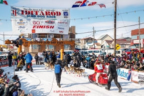 Mitch Seavey runs down the chute and crosses the finish line to win his third Iditarod in record time of 8 days, 3 hours, 40 minutes and 13 seconds in Nome during the 2017 Iditarod on Tuesday afternoon March 14, 2017.Photo by Jeff Schultz/SchultzPhoto.com  (C) 2017  ALL RIGHTS RESERVED