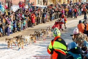 Mitch Seavey runs down Front street in Nome between the crowd to win his third Iditarod in record time of 8 days, 3 hours, 40 minutes and 13 seconds in Nome during the 2017 Iditarod on Tuesday afternoon March 14, 2017.Photo by Jeff Schultz/SchultzPhoto.com  (C) 2017  ALL RIGHTS RESERVED
