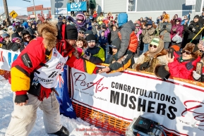 Mitch Seavey greets the crowd after winning his third Iditarod in record time of 8 days, 3 hours, 40 minutes and 13 seconds in Nome during the 2017 Iditarod on Tuesday afternoon March 14, 2017.Photo by Jeff Schultz/SchultzPhoto.com  (C) 2017  ALL RIGHTS RESERVED