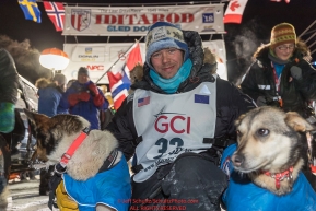Joar Leifseth Ulsom congratulates his leaders at the finish line in Nome, Alaska early on Wednesday morning March 14th as he wins the 46th running of the 2018 Iditarod Sled Dog Race.  He finished in 9 days 12 hours 00 minutes and 00 secondsPhoto by Jeff Schultz/SchultzPhoto.com  (C) 2018  ALL RIGHTS RESERVED