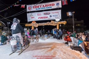 Nick Petit at the finish line in Nome, Alaska early on Wednesday morning March 14th as places 2nd in the 46th running of the 2018 Iditarod Sled Dog Race.  Photo by Jeff Schultz/SchultzPhoto.com  (C) 2018  ALL RIGHTS RESERVED
