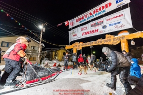 Mitch Seavey runs into the chute at the finish line in Nome, Alaska early on Wednesday morning March 14th as he places 3rd in the 46th running of the 2018 Iditarod Sled Dog Race.  Photo by Jeff Schultz/SchultzPhoto.com  (C) 2018  ALL RIGHTS RESERVED