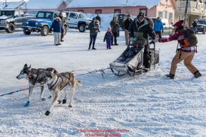Ray Redington Jr. gets a high-five as he runs on Front Street in Nome on the way to the a 4th place finish on Wednesday March 14th in the 46th running of the 2018 Iditarod Sled Dog Race.  Photo by Jeff Schultz/SchultzPhoto.com  (C) 2018  ALL RIGHTS RESERVED