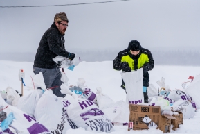Nate and Levi of Ruby, Alaska are helping to locate musher bags and get them to the staging area on March 14, 2020.