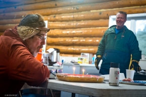 A suprise birthday celebration in Ruby, Alaska.  The cake was baked by a local resident through coordination by other volunteers on March 14, 2020.