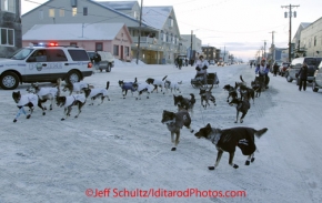 Thursday March 15, 2012   Martin and Rohn Buser run down front street together as they tie for 18th place at the finish line in Nome. Iditarod 2012.