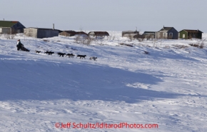 Thursday March 15, 2012  Jodi Bailey just inland from the sea ice of the Bering Sea at Fort Davis cabins nearing the finish in Nome. Iditarod 2012.