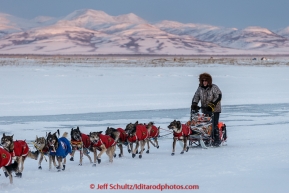 Jeff King runs on the slough arrivng at the Unalakleet  checkpoint at sunset on Sunday  March 15, 2015 during Iditarod 2015.  (C) Jeff Schultz/SchultzPhoto.com - ALL RIGHTS RESERVED DUPLICATION  PROHIBITED  WITHOUT  PERMISSION