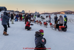 Jeff King arrives to a crowd on the slough at Unalakleet  checkpoint at sunset on Sunday  March 15, 2015 during Iditarod 2015.  (C) Jeff Schultz/SchultzPhoto.com - ALL RIGHTS RESERVED DUPLICATION  PROHIBITED  WITHOUT  PERMISSION