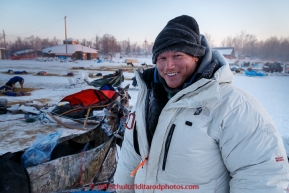 Steve Watkins getting ready to feed his dogs at the Huslia checkpoint on the morning of Sunday  March 15, 2015 during Iditarod 2015.  (C) Jeff Schultz/SchultzPhoto.com - ALL RIGHTS RESERVED DUPLICATION  PROHIBITED  WITHOUT  PERMISSION