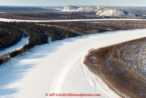 Teams run down the Yukon River on the way to the Koyukuk checkpoint on the afternoon of Sunday  March 15, 2015 during Iditarod 2015.  (C) Jeff Schultz/SchultzPhoto.com - ALL RIGHTS RESERVED DUPLICATION  PROHIBITED  WITHOUT  PERMISSION