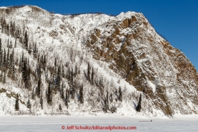 Anna Berington runs past cliffs and Koyukuk Mountain just prior to the Koyukuk checkpoint on the afternoon of Sunday  March 15, 2015 during Iditarod 2015.  (C) Jeff Schultz/SchultzPhoto.com - ALL RIGHTS RESERVED DUPLICATION  PROHIBITED  WITHOUT  PERMISSION