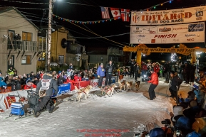 Dallas Seavey runs into the chute to win the 44th running of the Iditarod Sled Dog Race in Nome on Tuesday March 15th during the 2016 Iditarod in record time of 8 Days 11 hours 20 minutes 16 seconds   Photo by Jeff Schultz (C) 2016  ALL RIGHTS RESERVED