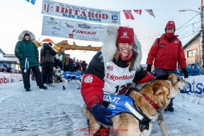 Aliy Zirkle poses with her lead dogs shortly after crossing the finish line in Nome for a third place finish on Tuesday March 15th during the 2016 Iditarod.  Alaska    Photo by Jeff Schultz (C) 2016  ALL RIGHTS RESERVED