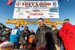Fifth-place finisher Pete Kaiser at the finish in Nome on Tuesday March 15th during the 2016 Iditarod.  Alaska    Photo by Jeff Schultz (C) 2016  ALL RIGHTS RESERVED