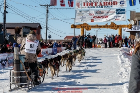 Jeff King runs up the finish chute in Nome on Tuesday March 15th during the 2016 Iditarod.  Alaska    Photo by Jeff Schultz (C) 2016  ALL RIGHTS RESERVED