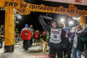 Dallas Seavey waves to the crowd after winning the 44th running of the Iditarod Sled Dog Race in Nome on Tuesday March 15th during the 2016 Iditarod in record time of 8 Days 11 hours 20 minutes 16 seconds Photo by Jeff Schultz (C) 2016  ALL RIGHTS RESERVED
