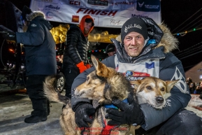 Dallas Seavey poses with his lead dogs shortly after winning the 44th running of the Iditarod Sled Dog Race in Nome on Tuesday March 15th during the 2016 Iditarod in record time of 8 Days 11 hours 20 minutes 16 seconds    Photo by Jeff Schultz (C) 2016  ALL RIGHTS RESERVED