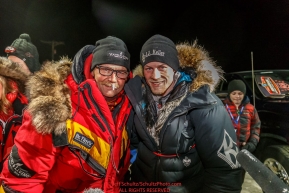 First place finisher Dallas Seavey (R) poses with his dad, Mitch Seavey, who finished in second place at the finish line in Nome on Tuesday March 15th during the 2016 Iditarod.  Alaska    Photo by Jeff Schultz (C) 2016  ALL RIGHTS RESERVED